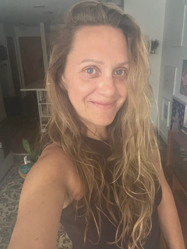 Carmen King, author of this reflection, smiling at home